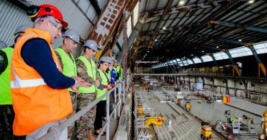 Tim Burnell, Chief Executive Officer of INCAT takes members of the Service Attachés and Advisory Group through the company's ship building facility in Hobart. Story by Kristi Cheng. Photo by Corporal Robert Whitmore.