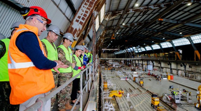 Tim Burnell, Chief Executive Officer of INCAT takes members of the Service Attachés and Advisory Group through the company's ship building facility in Hobart. Story by Kristi Cheng. Photo by Corporal Robert Whitmore.