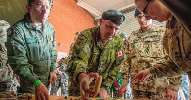 (L-R) Italian Air Force Defence Attaché Colonel Salvatore Trincone, Canadian Defence Attaché Colonel Richard Raymond, and German Deputy Defence Attaché Lieutenant Colonel (GS) Dominic Vogel, try food at HMAS Stirling. Story by Kristi Cheng. Photo by Corporal Robert Whitmore.