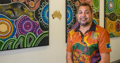 Nyoongar Artist Kevin Bynder with his artwork. Story by Peta Magorian. Photo by Sergeant Gary Dixon.