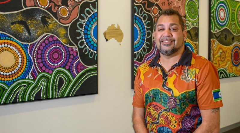 Nyoongar Artist Kevin Bynder with his artwork. Story by Peta Magorian. Photo by Sergeant Gary Dixon.