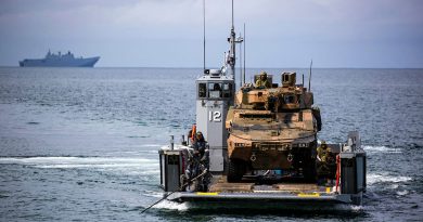 An Australian Army Boxer Combat Reconnaissance Vehicle from the 2nd/14th Light Horse Regiment prepares to disembark from one of HMAS Adelaide's Landing Craft near Cowley Beach Training Area, during Exercise Sea Explorer 2022. Story by Captain Joanne Leca. Photo by Corporal Cameron Pegg.