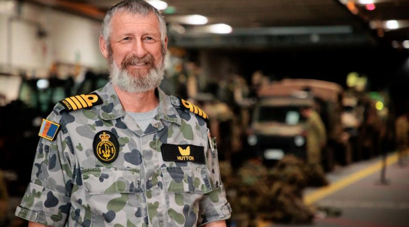 Captain Jim Hutton on the light vehicle deck of HMAS Adelaide during Exercise Sea Explorer. Story by Captain Joanne Leca. Photo by Corporal Robert Whitmore.