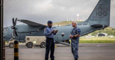 Operation Kimba Contingent Commander Wing Commander Michael Rouhan, right, speaks with Superintendent Steven Francis from the Royal PNG Constabulary at the Air Movements Wing – Port Moresby. Story by Lieutenant Geoff Long. Photo by Corporal Jonathan Goedhart.