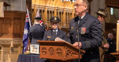 Royal Australian Air Force Officer Wing Commander Andrew Harrigan speaks to guests during the Sir Ross Smith commemorative service held at St Peter's Cathedral in Adelaide. Photo by Sergeant Murray Staff.