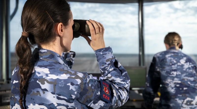 Royal Australian Air Force Air Traffic Controller, Flying Officer Charlotte Walsh (left) from No. 452 Squadron, spots an incoming aircraft at RAAF Base Tindal in the Northern Territory, during Exercise Diamond Storm 2022. Story by Flight Lieutenant Robert Hodgson.