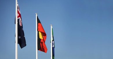 The Australian National Flag at full mast alongside the Aboriginal Flag and the Torres Strait Islander Flag at Darwin's Larrakeyah Barracks. Photo by Leading Seaman James Whittle.