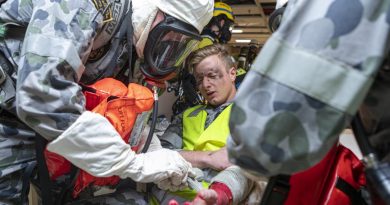 Navy personnel act as first responders during a simulated emergency on board HMAS Choules berthed at Fleet Base East in Sydney. Story by Lieutenant Max Logan. Photo by Able Seaman Benjamin Ricketts.