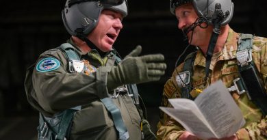 Royal Australian Air Force Flight Sergeant Ben Russell, left, speaks with US Air Force Technical Sergeant Eric Wiershcem at Joint Base Pearl Harbor-Hickam, Hawaii. Story by Staff Sergeant John Linzmeier and Eamon Hamilton. Photo by Staff Sergeant Alan Ricker (USAF).