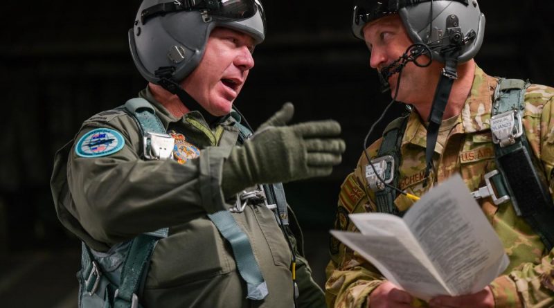 Royal Australian Air Force Flight Sergeant Ben Russell, left, speaks with US Air Force Technical Sergeant Eric Wiershcem at Joint Base Pearl Harbor-Hickam, Hawaii. Story by Staff Sergeant John Linzmeier and Eamon Hamilton. Photo by Staff Sergeant Alan Ricker (USAF).