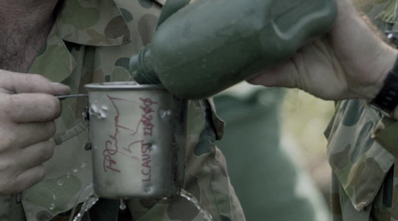 Private Adrian Crutchley and Corporal Hawkins, 7 Section, 6 Platoon, 6RAR, within canteen 'fragged' in a grenade attack on their position in East Timor, July 2000. Photo by Corporal Kevin Piggott.