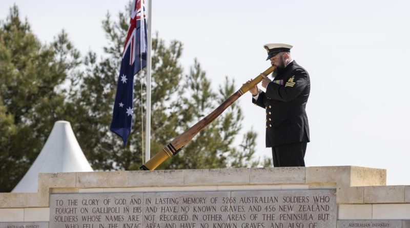 Petty Officer Jordan Bradshaw plays the didgeridoo at the Anzac Day commemorative service at Lone Pine, Gallipoli. Story by Sergeant Matthew Bickerton. Photo by Corporal David Cotton.