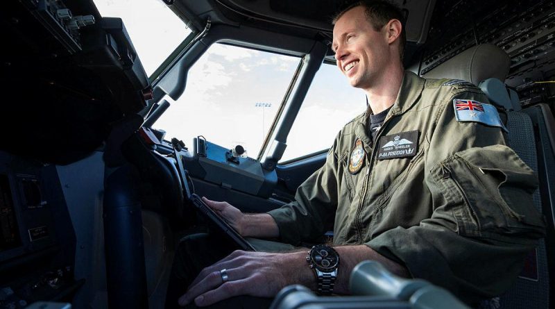 Pilot Flight Lieutenant Angus Wheeler, from No. 292 Squadron, plans the departure and arrival for an upcoming mission in the flight deck of a P-8A Poseidon aircraft at RAAF Base Edinburgh. Story by Corporal Veronica O'Hara. Photo by Leading Aircraftman Sam Price.