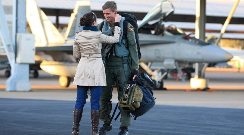 Wing Commander Martin Parker is greeted by his wife Chantelle on returning from the final mission of his fighter combat instructor course in 2011. Story by Warrant Officer Class 2 Max Bree. Photo by Leading Aircraftman Mark Friend.