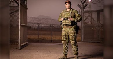 Sergeant Troy Wyley stands at the front gate of the Multinational Forces and Observers South Camp on Operation Mazurka in South Sinai, Egypt. Photo by Corporal Jonathan Goedhart.