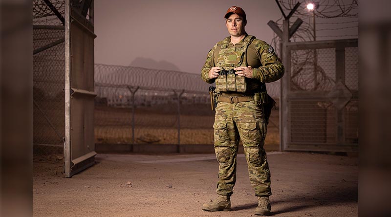 Sergeant Troy Wyley stands at the front gate of the Multinational Forces and Observers South Camp on Operation Mazurka in South Sinai, Egypt. Photo by Corporal Jonathan Goedhart.