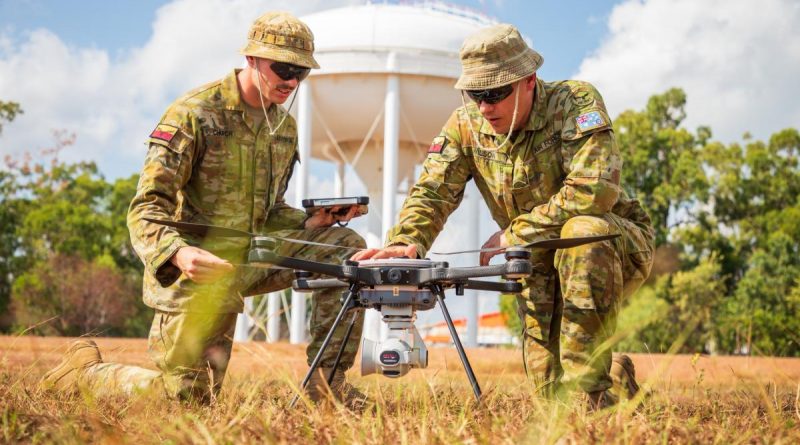 Air Force Security Aircraftman Joshua Church, left, and Airfield Defence Guard Leading Aircraftman David Wilson conduct a post-flight inspection of the R70 Sky Ranger unmanned aerial system. Story by Flight Lieutenant Katrina Thomasson. Photo by Leading Aircraftman Sam Price.