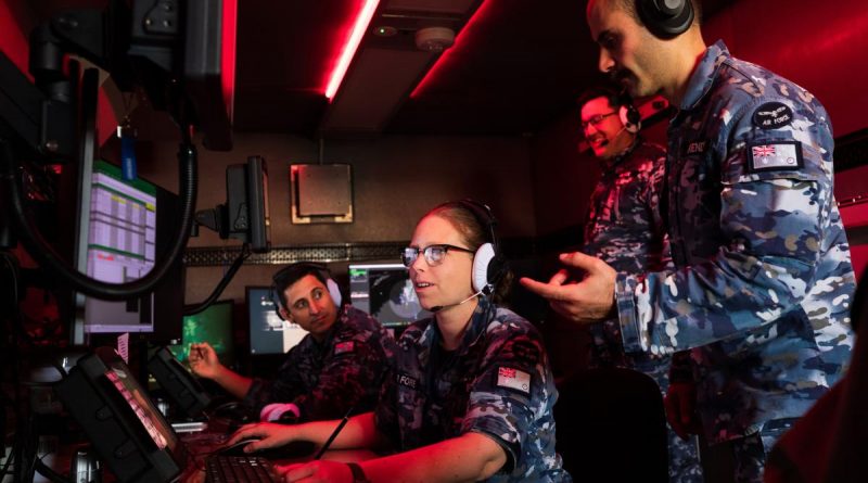 Air Surveillance Operator Sergeant Jayne Francis monitors the exercise airspace inside an operations cabin with aviators from No. 114 Mobile Control and Reporting Unit at RAAF Base Darwin. Story by Flight Lieutenant Robert Hodgson. Photo by Leading Aircraftman Sam Price.