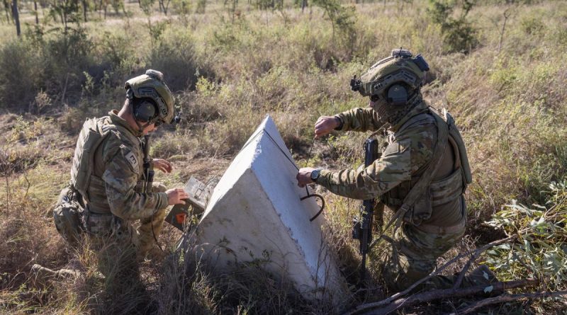 Australian Army soldiers from the 3rd Combat Engineer Regiment prepare to detonate a satchel charge during a breaching activity on Exercise Thunder Rage at Townsville Field Training Area on June 13, 2022. Story by Captain Diana Jennings. Photo by Gunner Gregory Scott.