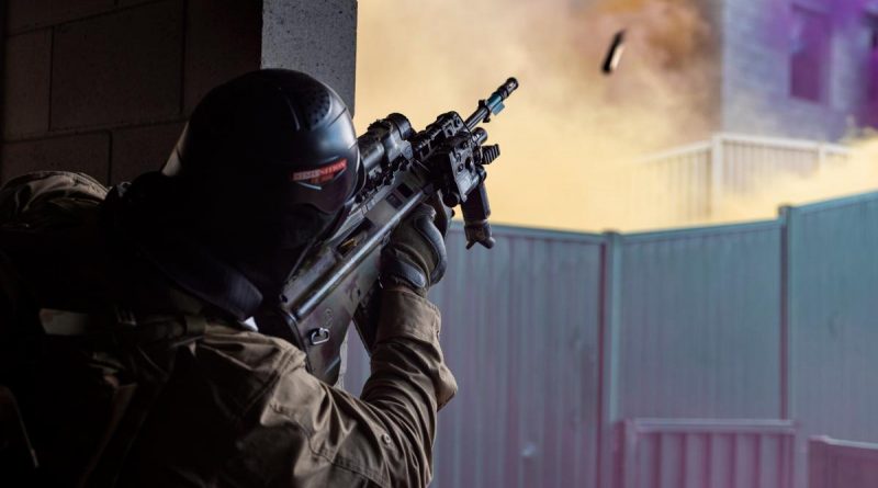 A rifleman from Alpha Company, 8th/9th Battalion, Royal Australian Regiment, fires an F88 Austeyr rifle during urban operations training held as part of Exercise Ram Horn at the Wide Bay training area. Story by Captain Taylor Lynch. Photo by Corporal Nicole Dorrett.