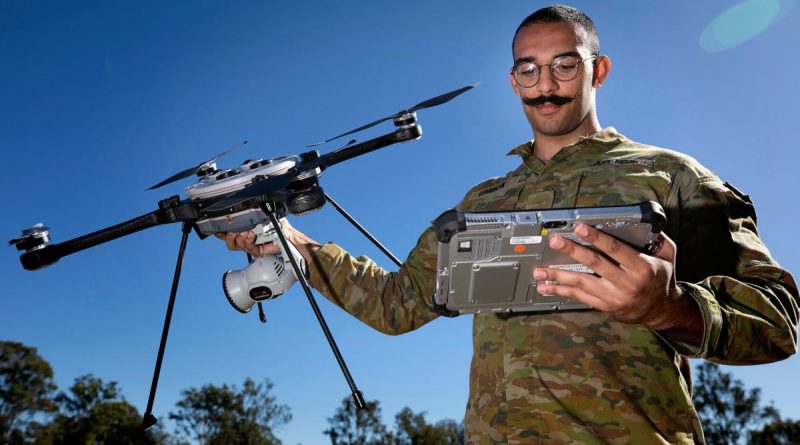 Drone operator Leading Aircraftman Sam Payda with a R70 Skyranger at the Air Force Drone Racing Tournament Exhibition day at RAAF Base Amberley. Story by Corporal Veronica O'Hara. Photo by Leading Aircraftwoman Kate Czerny.
