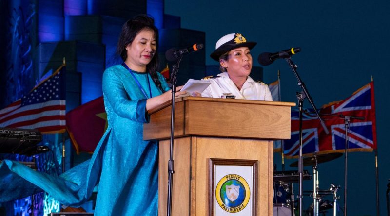 Royal Australian Navy Maritime Human Resources Officer Lieutenant Vicky Nguyen, right, acts as Master of Ceremonies during the Pacific Partnership 2022 opening ceremony. Story by Captain Lily Charles. Photo supplied.