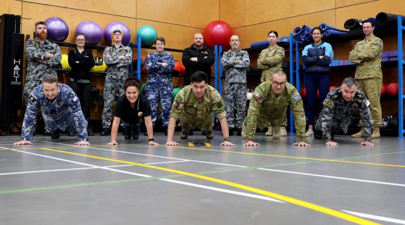 ADF personnel, Defence civilians and a member from the New Zealand Defence Force, at Head Quarters Joint Operations Command, after completing the push-up challenge. Story and photo by Sergeant Matthew Bickerton.