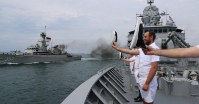 Ship's company of HMAS Perth ‘cheer ship’ to Indonesian Navy ship KRI Bung Tomo during a cooperative activity near Jakarta, Indonesia. Story by Lieutenant Eleanor Williams and Lieutenant Max Logan.