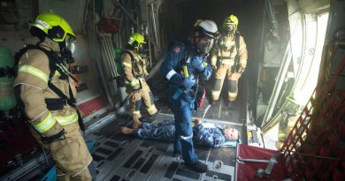 Air Force firefighters during the airfield emergency plan rehearsal at RAAF Base Richmond. Story by Flight Lieutenant Dean Squire. Photo by Sergeant Greg O'Neill.