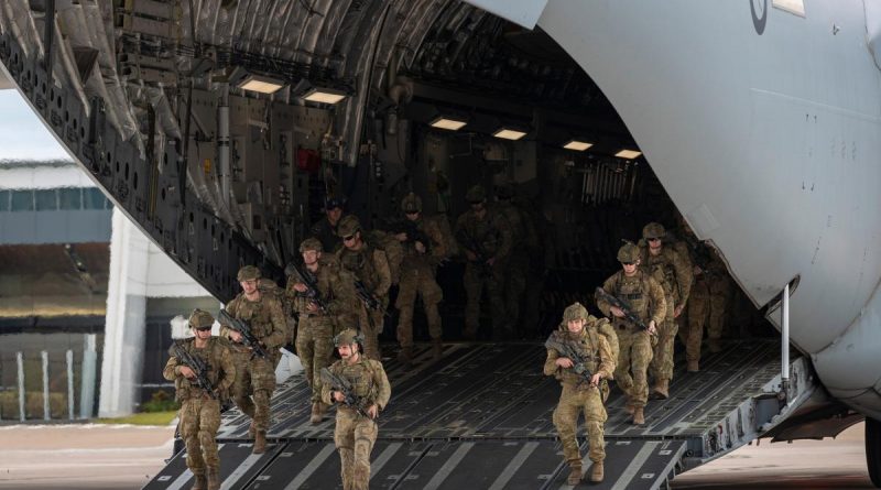 Army riflemen from Bravo Company of the 8th/9th Battalion, The Royal Australian Regiment, dismount a Royal Australian Air Force C-17A Globemaster after arriving at Toowoomba Airport. Story and photo by Corporal Nicole Dorrett.