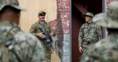 Private Lucas Hinselwood from 1st Battalion, the Royal Australian Regiment briefs marines from the Mexican Naval Infantry during Urban Close Combat training on RIMPAC 2022. Story by Flying Officer Lily Lancaster. Photo by Corporal John Solomon.