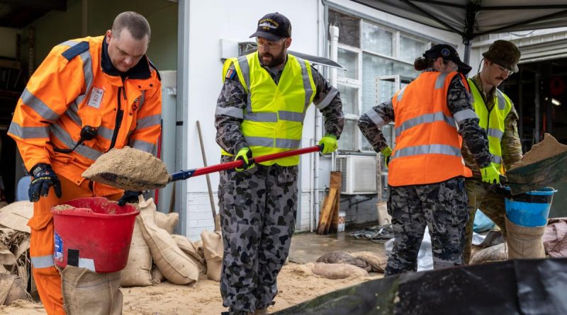 State Emergency Service and Royal Australian Navy and Australian Army personnel from Joint Task Force 629 conduct sandbagging at the Mount Druitt State Emergency Service depot to assist in the flood response efforts in New South Wales.