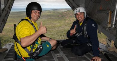 Australian Olympic Committee Indigenous Advisory Committee members and former Olympic athletes Kyle Vander-Kuyp (left) and Patrick Johnson during a flight over the Torres Strait Islands in an Air Force C-27J. Story by Flight Lieutenant Suellen Heath. Photo by Leading Aircraftwoman Kate Czerny.