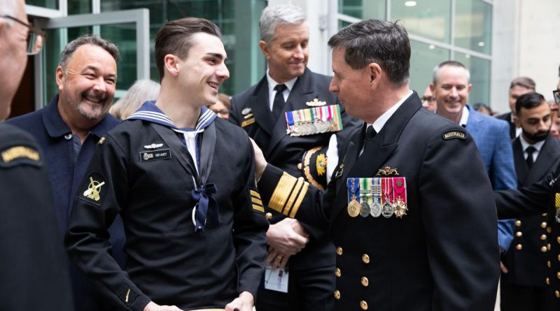 Navy Cadet Chief Petty Officer Rory Jacket, left, congratulates Vice Admiral Mark Hammond after the Chief of Navy Change of Command Ceremony at Russell Offices, Canberra. Photo by Lieutenant Carolyn Martin and Lieutenant Brendan Trembath.