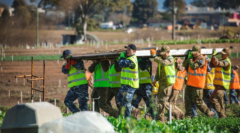 Australian Defence Force personnel assist homeowners affected by floods in Mulgrave, New South Wales. Story by Major Martin Hadley. Photo by Leading Aircraftman Adam Abela.