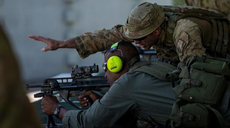 Australian Army rifleman Corporal Joshua Townsend coaches a soldier from the Republic of Fiji Military Forces during a live-fire qualifying shoot at Gallipoli Barracks. Story by Warrant Officer Class Two Max Bree. Photo by Corporal Nicole Dorrett.