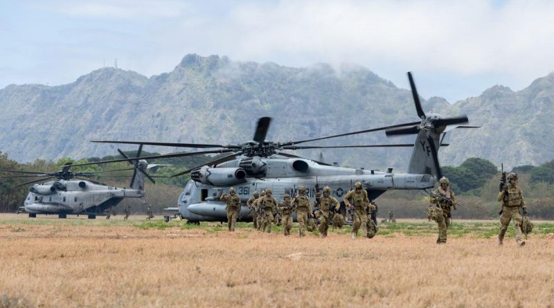 Australian Army soldiers from 1st Battalion, Royal Australian Regiment, disembark from two US Marine Corps CH-53 Sea Stallions during a simulated urban close combat scenario on Exercise Rim of the Pacific (RIMPAC) 2022. Story by Flying Officer Lily Lancaster. Photo by Corporal John Solomon.