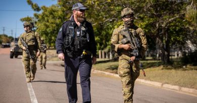 Soldiers from the 3rd Battalion, Royal Australian Regiment, and Queensland Police Service Officer Tony Hoise patrol through Charters Towers in Queensland, during Exercise Brolga Run 2022. Story by Major Megan McDermott. Photo by Gunner Gregory Scott.