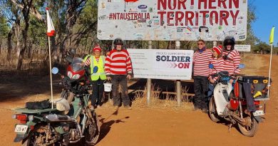 Dr Michael Davey, right, and his team stop for a photo at the Northern Territory border as they ride around Australia raising money for Soldier On. Story by Sergeant Matthew Bickerton. Photo by Sergeant Sebastian Beurich.