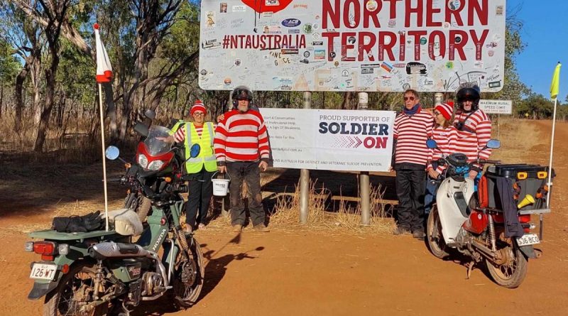 Dr Michael Davey, right, and his team stop for a photo at the Northern Territory border as they ride around Australia raising money for Soldier On. Story by Sergeant Matthew Bickerton. Photo by Sergeant Sebastian Beurich.