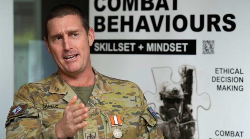 Warrant Officer Class Two Stuart Camac briefed 7th Brigade on his rotation to Egypt after being presented the Multinational Force and Observers Medal as he was farewelled from 26 years full time service. Story and photo by Major Roger Brennan.