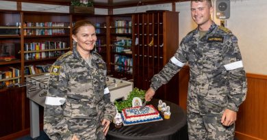 Major Raechel Driscoll and Private Caylun Dukes-Grenfell cut a cake to commemorate the 120th birthday of the Royal Australian Army Ordnance Corps on board HMAS Canberra during Exercise Rim of the Pacific 2022. Photo by Leading Seaman Matthew Lyall.