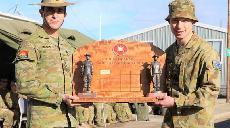 Chief of Army Lieutenant General Simon Stuart presents the Chief of Army trophy to Cadet Under Officer Kane Blake, leader of the winning team from the Victorian Army Cadets Brigade. Story by Sergeant Matthew Bickerton. Photo supplied.