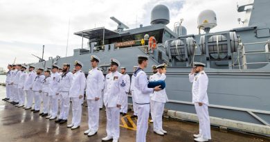 Deputy Chief of Navy Rear Admiral Christopher Smith inspects the ship's company of Australian Defence Vessel Cape Otway during the boat's official welcome to its home port of Cairns. Story by Lieutenant Nancy Cotton. Photo by Able Seaman Susan Mossop.