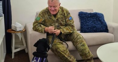 Warrant Officer Class Two Kym O'Leary with Labrador 'York', a Royal Society for the Blind dog in training, at the Keswick Cafe at Keswick Barracks in Adelaide. Story by Corporal Melina Young.