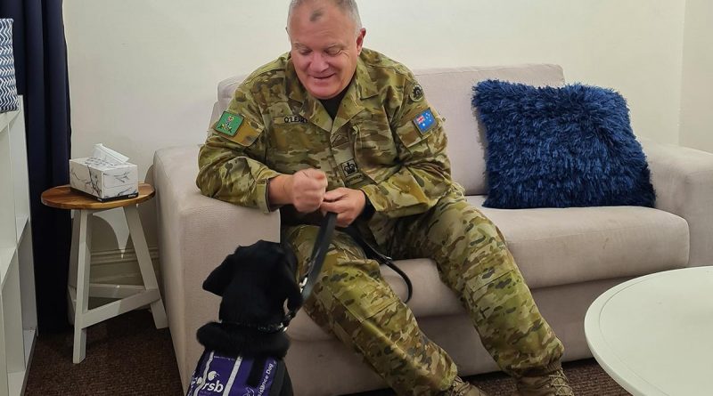 Warrant Officer Class Two Kym O'Leary with Labrador 'York', a Royal Society for the Blind dog in training, at the Keswick Cafe at Keswick Barracks in Adelaide. Story by Corporal Melina Young.