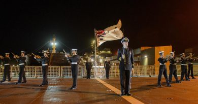 HMAS Stalwart's ceremonial guard conducts a ceremonial sunset at the ship's official reception during its inaugural port visit to Geraldton, Western Australia. Story by Lieutenant Gary McHugh. Photo by Sergeant Gary Dixon.