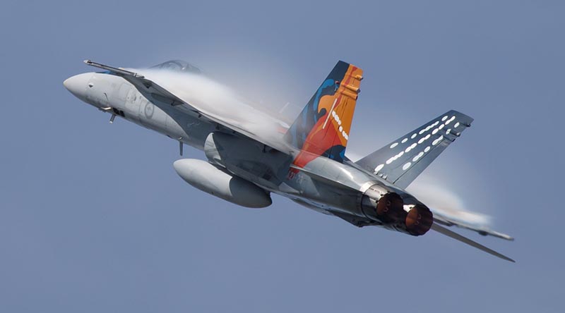 Royal Australian Air Force F/A-18A 'Worimi' Hornet conducts a handling display for its final flight before retirement at RAAF Base Williamtown, New South Wales. Photo by Corporal Craig Barrett.