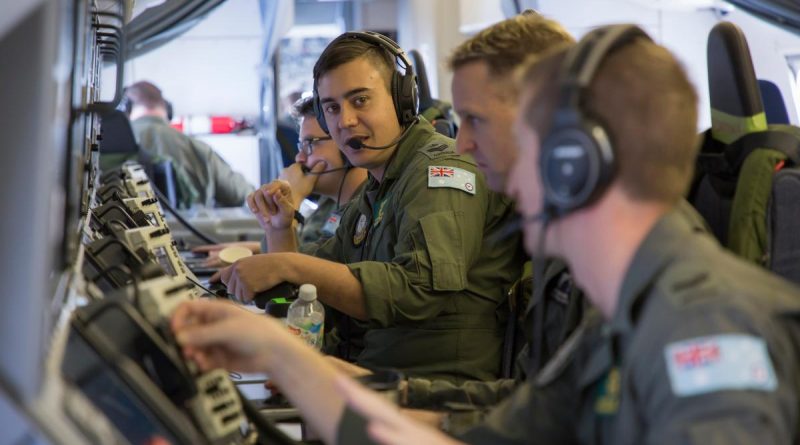 No. 11 Squadron airborne electronic analysts keep constant communications flowing for situational awareness on board the P-8A Poseidon during a mission as part of Operation Resolute. Story by Wing Commander Mark Williams. Photo by Corporal Craig Barrett.