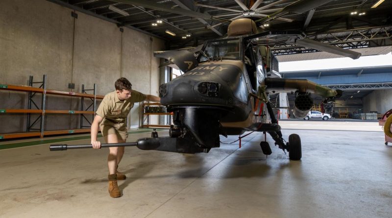 Craftsman Cameron Powell moves the 30mm cannon on a Tiger armed reconnaissance helicopter at Robertson Barracks in Darwin. Story by Captain Carolyn Barnett. Photo by Corporal Rodrigo Villablanca.